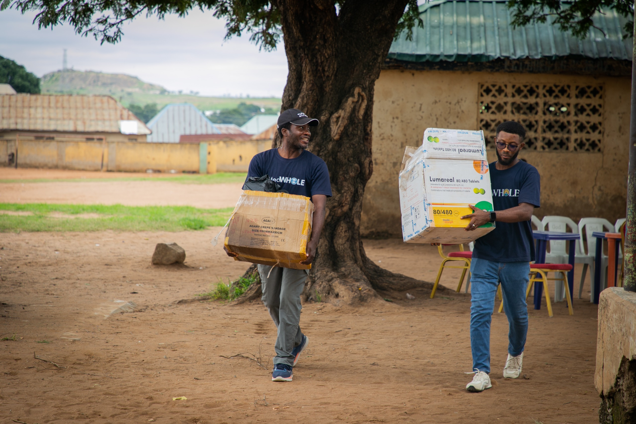 MedWHOLE volunteers and community members serving together in the village